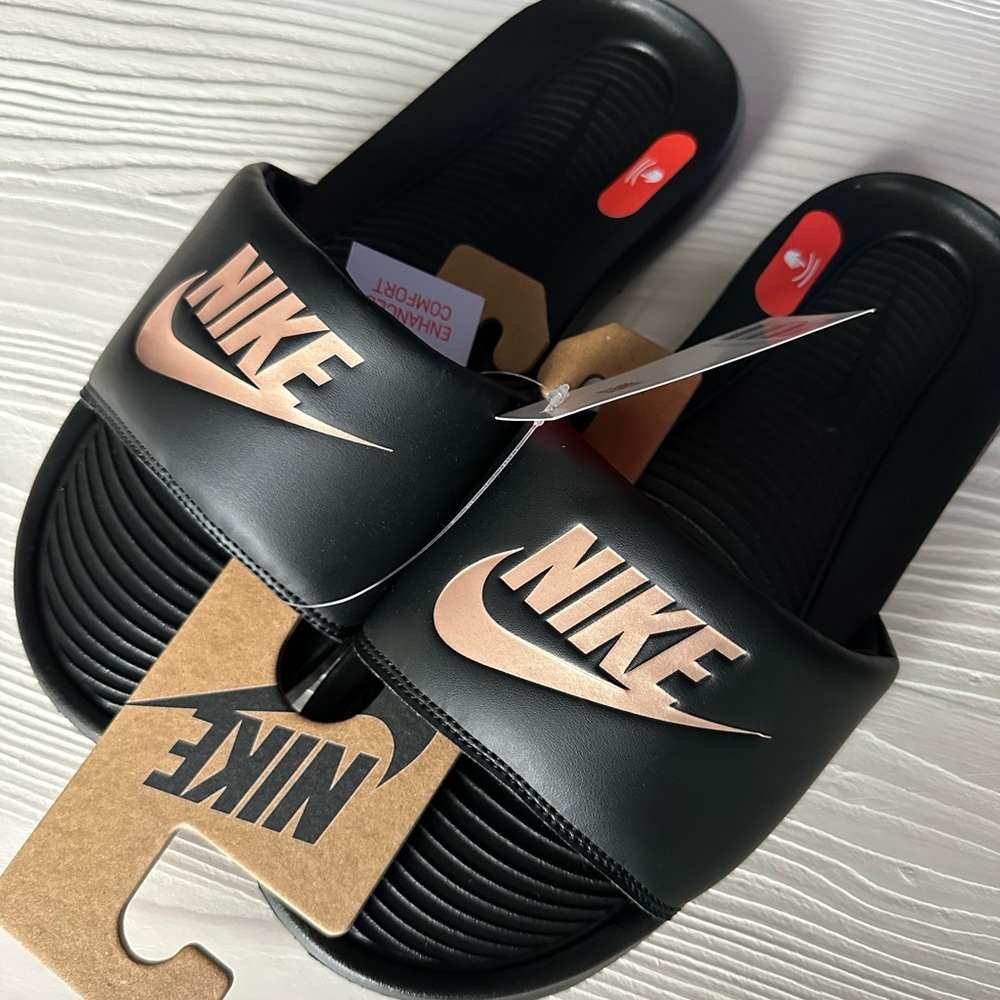 Nike Black Slides with Metallic Red-Bronze Accents